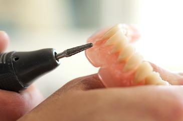 Close up of dentist making custom dentures in Mt Pleasant SC