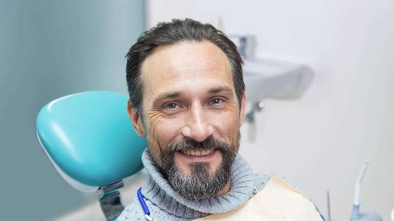 Man in dental chair smiling in mt pleasant, sc