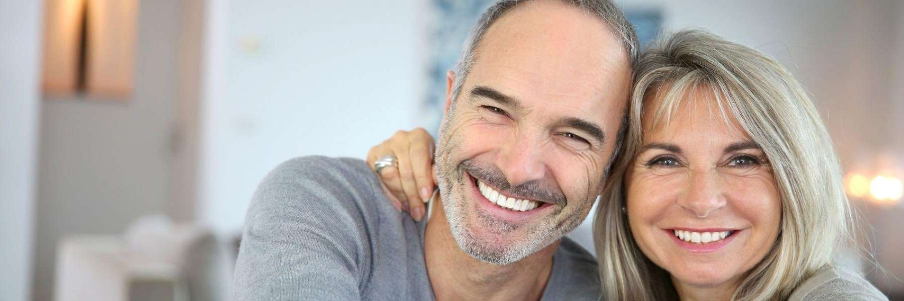 older couple hugging inside | dentist mount pleasant