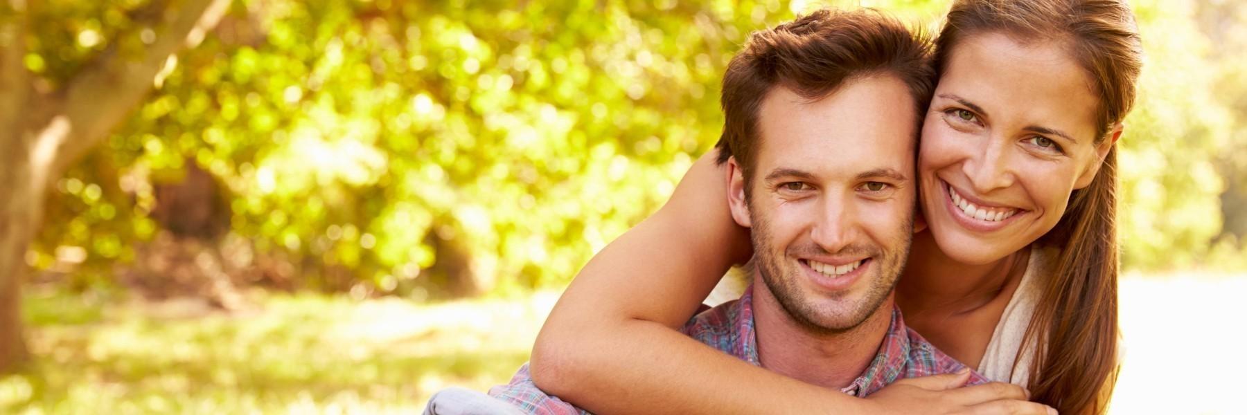 Couple smiling at Palmetto Islands County Park in Mt Pleasant SC