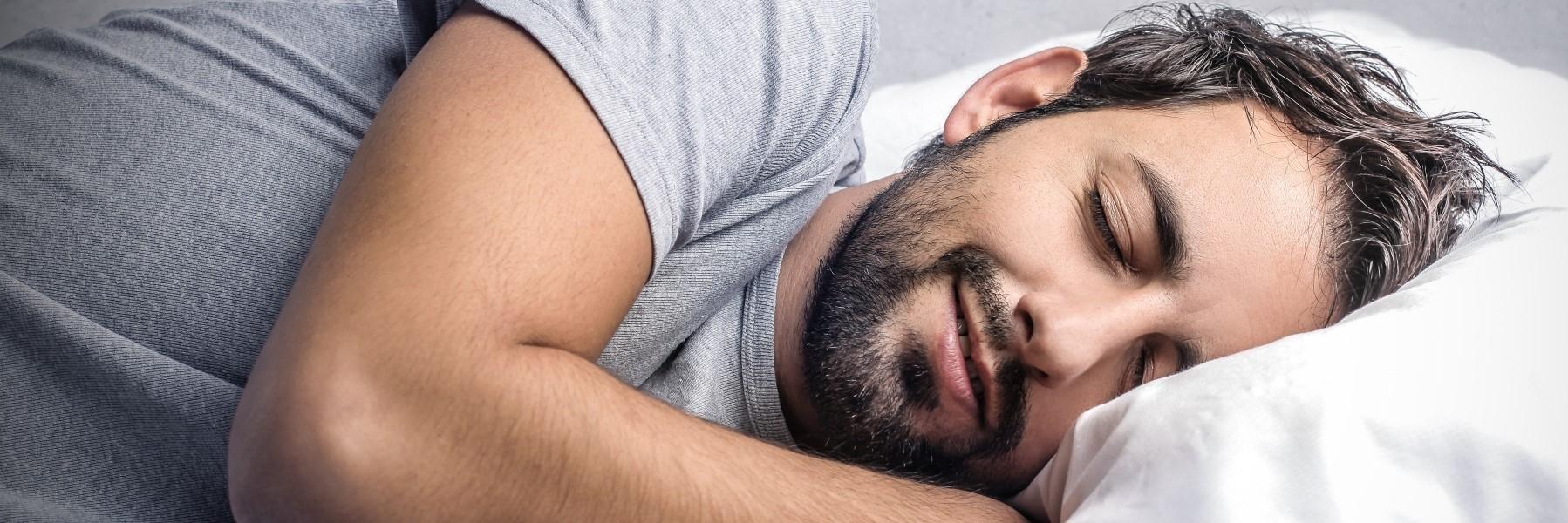 Man sleeping after sleep apnea treatment in Mt Pleasant